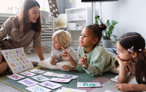 Teacher and children in a bright Montessori classroom at Shining Star Montessori Preschool, Anaheim
